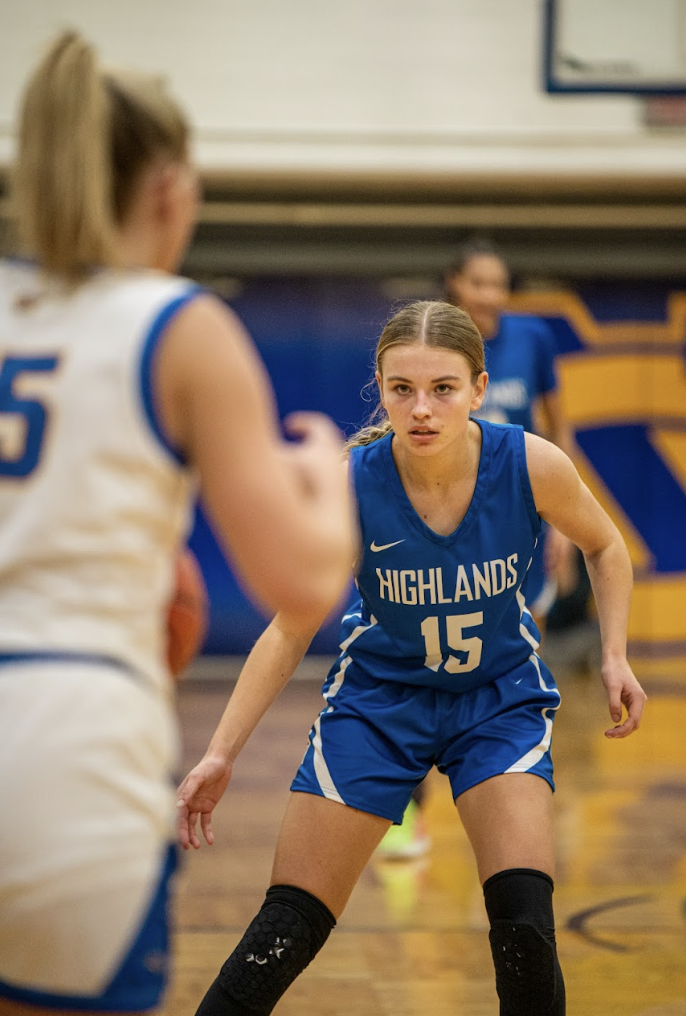 Katie Bucher (11) fouses while playing defense. 